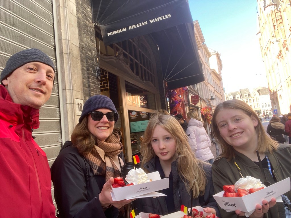 Tepaskes in Bruges eating Belgian waffles.